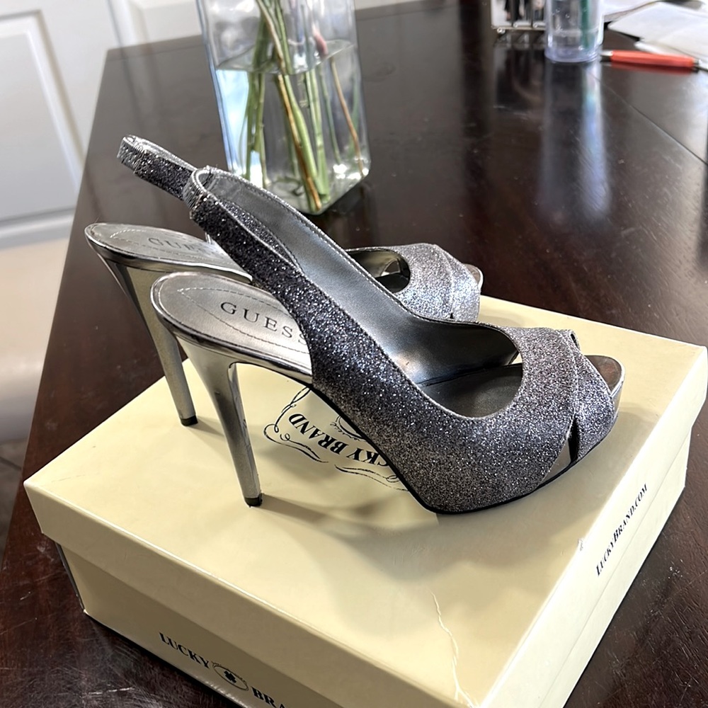 Used Guess silver glitter platforms.